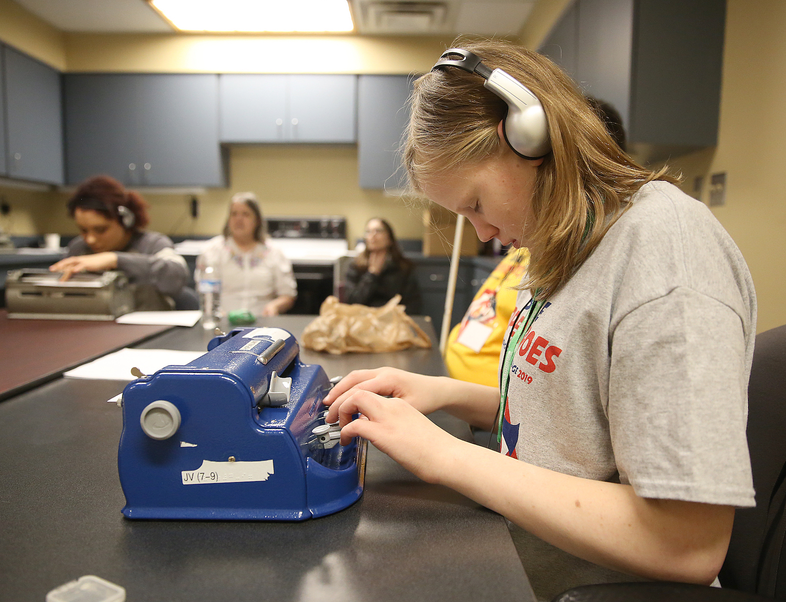 A student competes in one of five skills contest at the Ohio Regional Braille Challenge, working on her Brailler to accurately transcribe an audio recording.