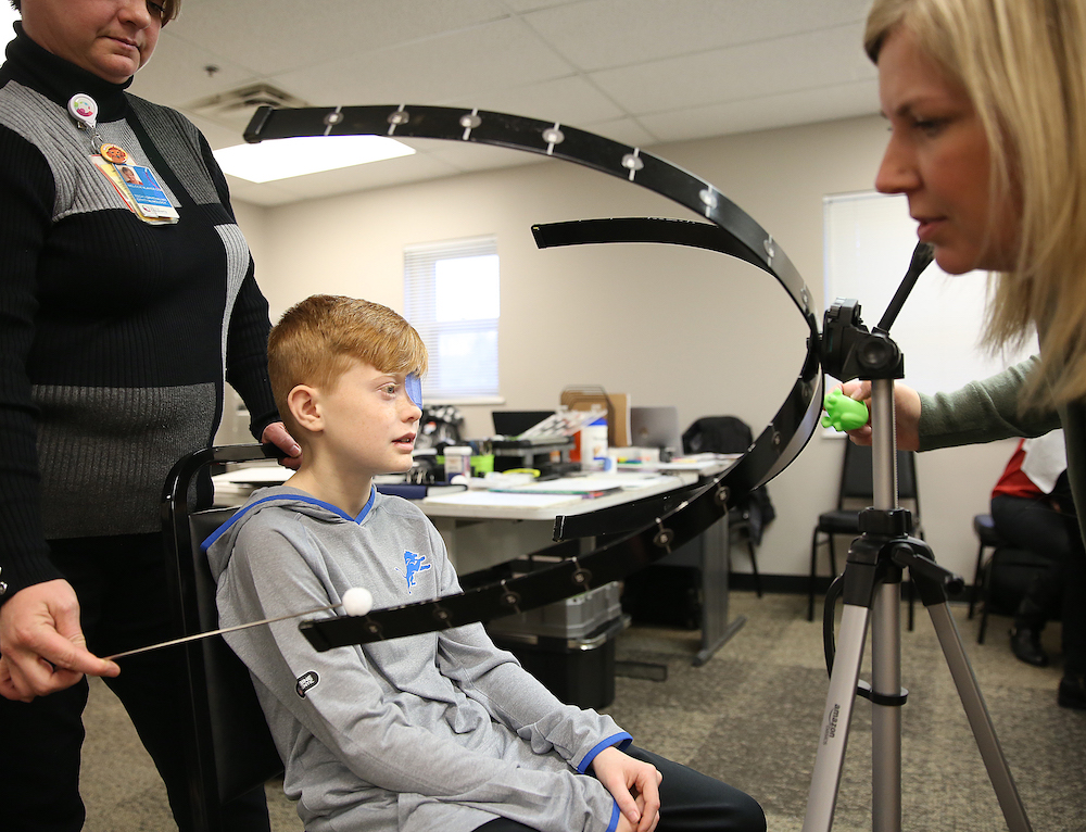 A child receives an eye exam during a low vision clinic at Clovernook Center