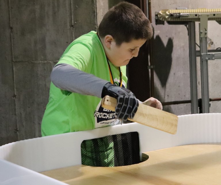boy hitting a ball as he plays showdown