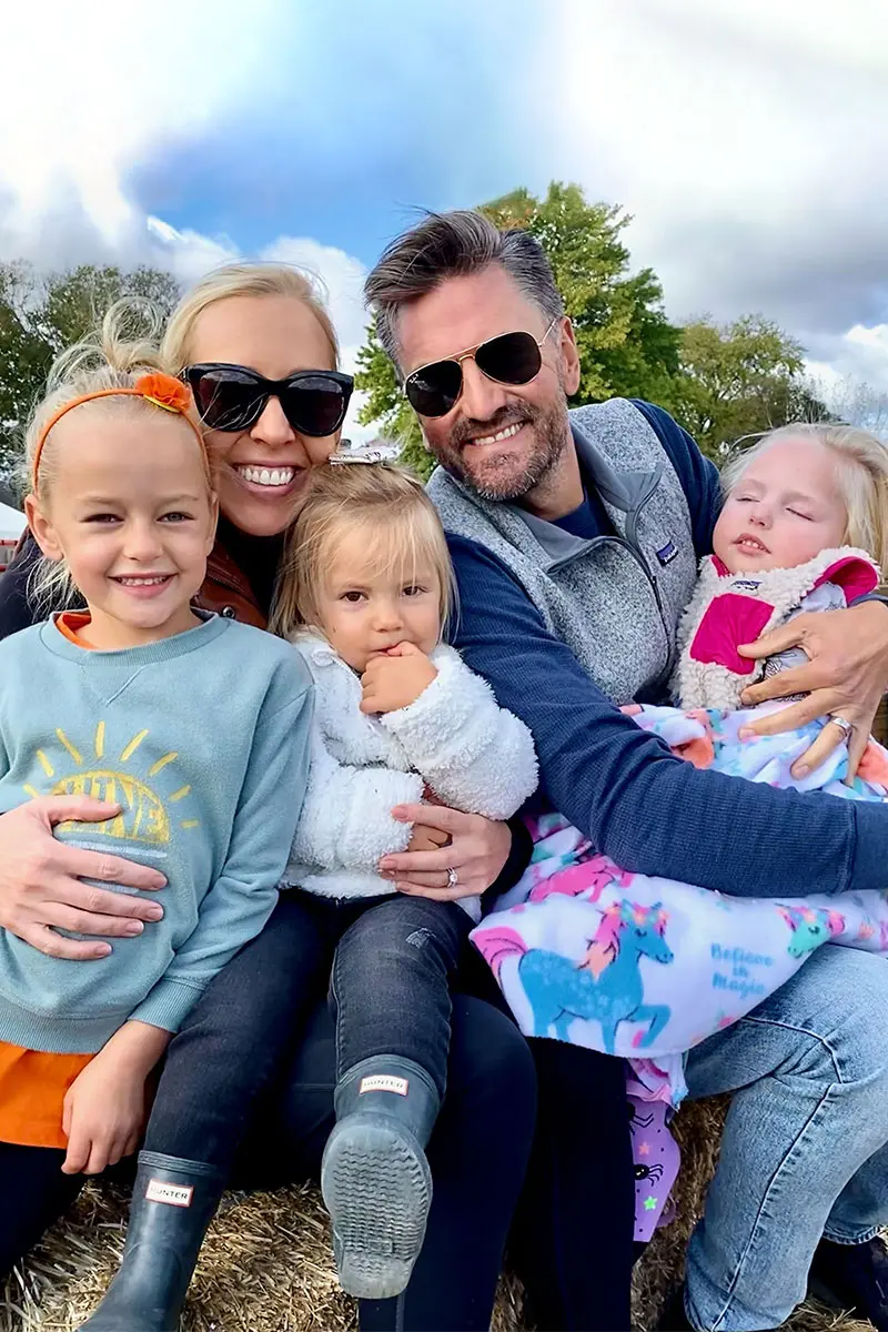 The Maccani family poses for a picture while on a hayride.