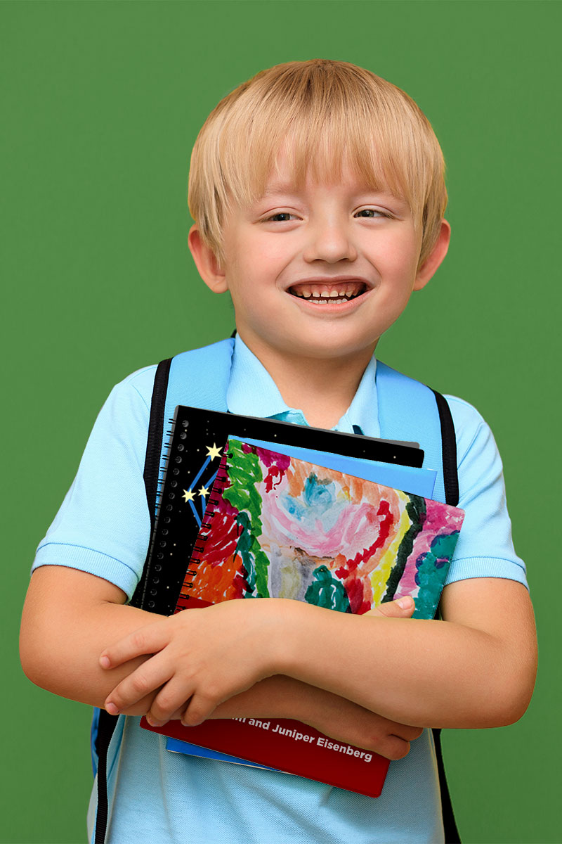 A young, smiling boy in a blue shirt hugs a stack of Clovernook books to his chest.